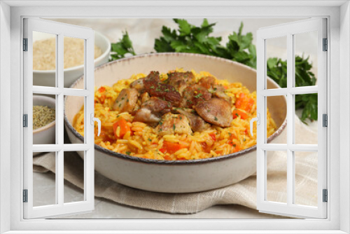 Fototapeta Naklejka Na Ścianę Okno 3D - Delicious pilaf with meat and ingredients on light grey table, closeup