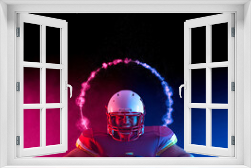 Fototapeta Naklejka Na Ścianę Okno 3D - American football player at game day. Template for a sports magazine on the theme of American football with copy space. Mockup for sports website.