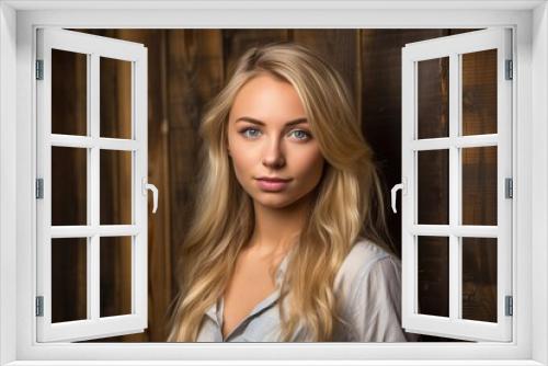 a gorgeous young blonde woman against a wooden background