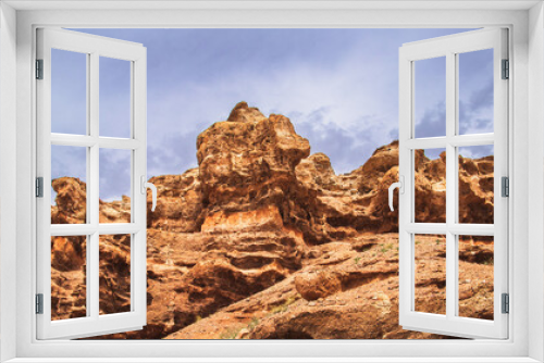 Fototapeta Naklejka Na Ścianę Okno 3D - Red rock wall of the Charyn canyon in the national park of the Almaty region. Picturesque nature of middle asia.