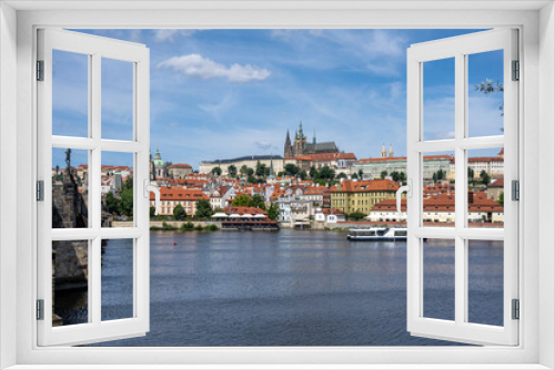 Fototapeta Naklejka Na Ścianę Okno 3D - View to the Castle Hradcany in Prague on a sunny day with the famous Charles Bridge on the left