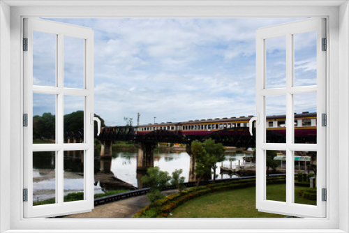 Steel railway bridge over river kwai of landmarks memorials historical sites and monuments World War II Sites for thai people foreign travelers travel visit and train running in Kanchanaburi, Thailand