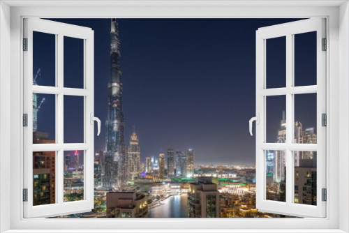 Fototapeta Naklejka Na Ścianę Okno 3D - Dubai Downtown cityscape with tallest skyscrapers around aerial day to night timelapse.