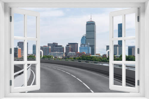 Fototapeta Naklejka Na Ścianę Okno 3D - Empty urban asphalt road exterior with city buildings background. New modern highway concrete construction. Concept of way to success. Transportation logistic industry fast delivery. Boston. USA.