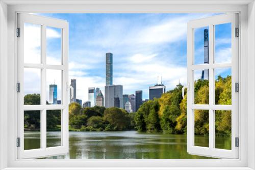 Fototapeta Naklejka Na Ścianę Okno 3D - Midtown Manhattan skyscrapers with a view from The Lake at Central Park in NYC