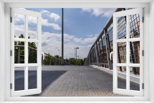 Fototapeta Naklejka Na Ścianę Okno 3D - A metal and concrete walkway