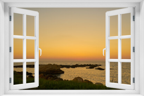Fototapeta Naklejka Na Ścianę Okno 3D - A colorful sunset on the rocky Mediterranean coast.