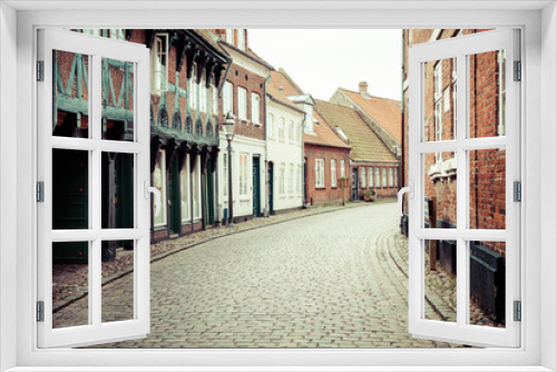 Fototapeta Naklejka Na Ścianę Okno 3D - Street with old houses from royal town Ribe in Denmark
