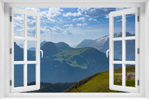 Fototapeta Naklejka Na Ścianę Okno 3D - A view of the Dolomites and the countryside into Val di Fassa - Timelapse