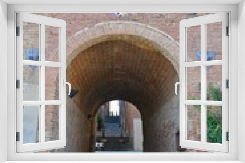 Fototapeta Naklejka Na Ścianę Okno 3D - An ancient entrance arch in Torrita di Siena, a medieval town in Tuscany.