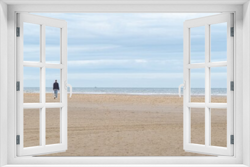 Fototapeta Naklejka Na Ścianę Okno 3D - person walking on the beach