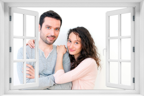 Portrait of a young happy couple on a white background