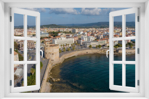 Fototapeta Naklejka Na Ścianę Okno 3D - Aerial view of the old town of Alghero in Sardinia. Photo taken with a drone on a sunny day. Panoramic view of the old town and harbor of Alghero, Sardinia, Italy.