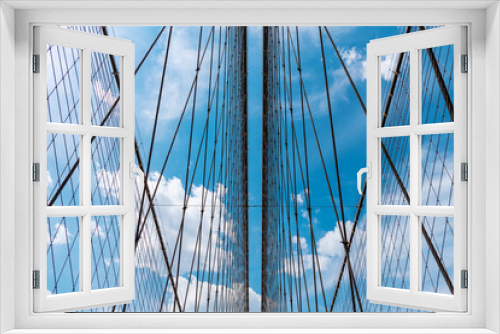 Fototapeta Naklejka Na Ścianę Okno 3D - structure architecture. brooklyn bridge in new york. urban architecture of new york city. way to manhattan. architecture of historic bridge in brooklyn. structural part of bridge