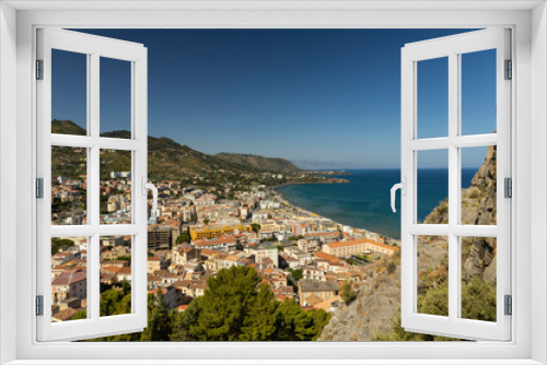 Fototapeta Naklejka Na Ścianę Okno 3D - View of Cefalù, the city, the cathedral and its castle. Panorama seen from above of the whole landscape. Rough sea during sunset. The most beautiful places in Sicily. Excellent tourist destination.