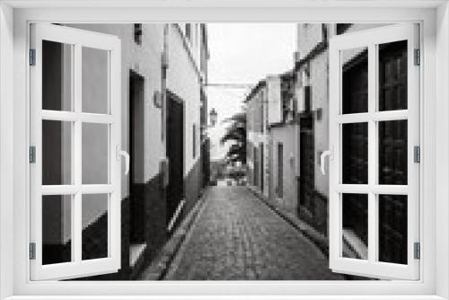Fototapeta Naklejka Na Ścianę Okno 3D - Narrow streets of the old town of Icod de los Vinos, on the northern coast of Tenerife. Canary Islands, Spain. Black and white.