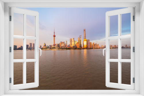 Fototapeta Naklejka Na Ścianę Okno 3D - Illuminated Shanghai Skyline Reflecting On River	
