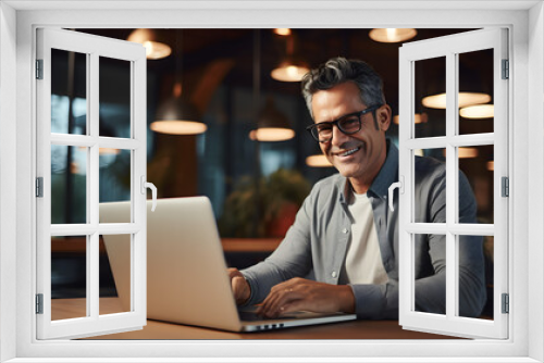 Portrait of mature Indian or Latin business man ceo trader using laptop computer, typing, working in modern office. Middle-age Hispanic smiling handsome businessman entrepreneur. Generative AI