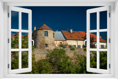 Houses near old square in sunny hot autumn day in Kadan