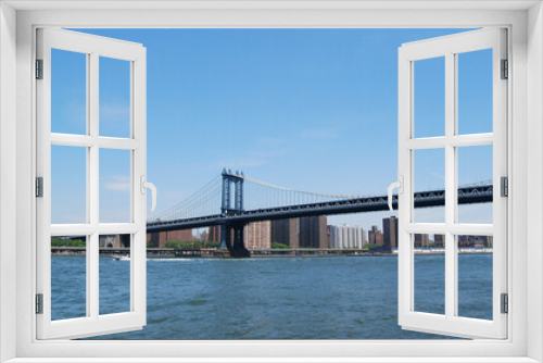 Fototapeta Naklejka Na Ścianę Okno 3D - The blue Manhattan Bridge as seen from Brooklyn in New York City, New York, USA