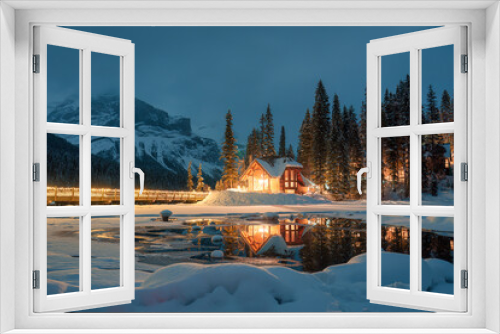 Fototapeta Naklejka Na Ścianę Okno 3D - Emerald Lake with snow covered and wooden lodge glowing in pine forest on winter at Yoho national park, Canada
