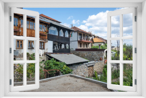 Fototapeta Naklejka Na Ścianę Okno 3D - Village of Delchevo with authentic houses, Bulgaria