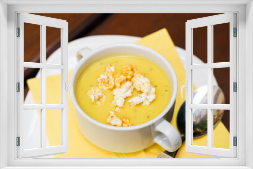 Fototapeta Naklejka Na Ścianę Okno 3D - Bowl of sweet corn soup with popcorn on a wooden table