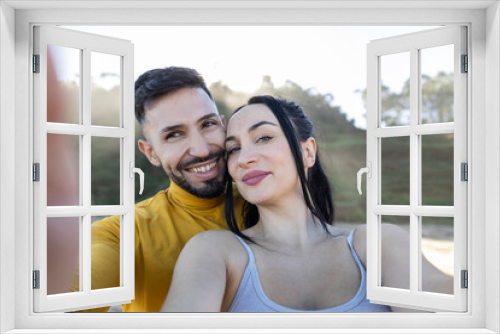 happy diverse couple celebrating their honeymoon trip to paradisiacal beach in summer