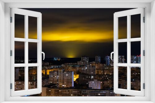 Fototapeta Naklejka Na Ścianę Okno 3D - Light pollution of nature - glow in night clouds over a city with multi-storey buildings, the problem of urbanization and ecology