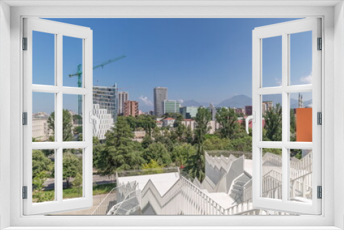 Fototapeta Naklejka Na Ścianę Okno 3D - Panorama showing cityscape over Tirana with its colorful apartment buildings and skyscrapers timelapse, Tirana, Albania.