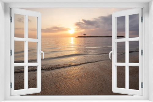 Fototapeta Naklejka Na Ścianę Okno 3D - Landscape shot in Bali. Sunrise or sunset at Sanur beach. Beautiful sandy beach in the morning, with fine sand and a view of the calm sea. Temples are in the water. A dream in Indonesia