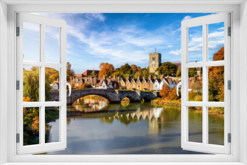 Fototapeta Naklejka Na Ścianę Okno 3D - Panoramic view of Aylesford village in Kent, England with medieval bridge over the river Medway during golden autumn time