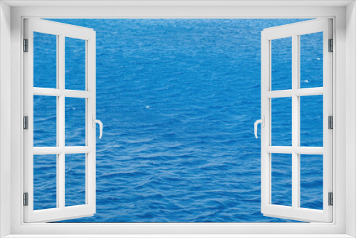 Fototapeta Naklejka Na Ścianę Okno 3D - Rippled empty sea background texture, close up view. Wavy blue ocean water, ad template, copy space