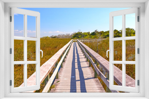 Fototapeta Naklejka Na Ścianę Okno 3D - Boardwalk Through a Wetland Marsh