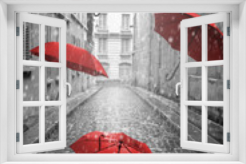 Fototapeta Naklejka Na Ścianę Okno 3D - Red umbrellas flying on the street. Conceptual image