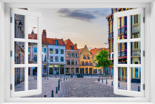 Fototapeta Naklejka Na Ścianę Okno 3D - Vieux Lille old town quarter with empty narrow cobblestone street, paving stone square with old colorful buildings in historical city centre, French Flanders, Hauts-de-France Region, Northern France