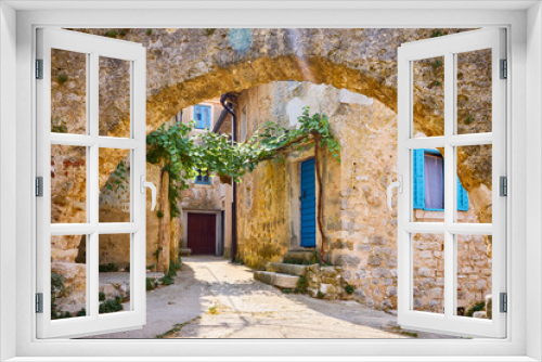 Fototapeta Naklejka Na Ścianę Okno 3D - Croatia Istria. Ancient abandoned medieval town Plomin. Old stone street with ruined walls houses and stairs overgrown by ivy plants