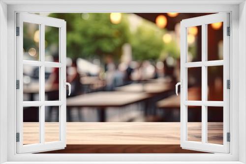 Cozy coffee shop ambience. Blurred interior. Retro restaurant vibes. Vintage empty wooden table background. Abstract business setup. Blurry wood and top lighting