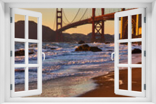 Fototapeta Naklejka Na Ścianę Okno 3D - Footprints from bare feet coming out of water and waves with Golden Gate Bridge
