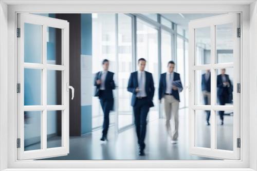 Blurred motion image of businessmen in the office walking 