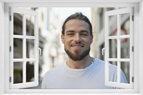 Young hispanic man smiling confident standing at street