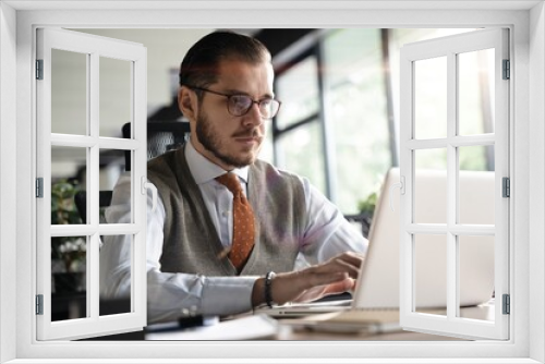 Modern Office Businessman Working on Computer. Portrait of Successful Middle-aged IT Software Engineer Working on Laptop