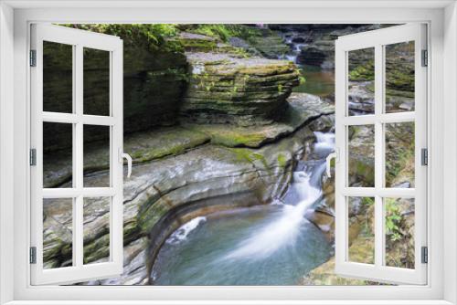 Fototapeta Naklejka Na Ścianę Okno 3D - Multiple cascading waterfalls in a gorge in Watkins Glen State Park, New York, USA