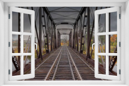 Fototapeta Naklejka Na Ścianę Okno 3D - Double span riveted railway truss bridge built in 1893 crossing the Mississippi river in autumn in Galetta, Ontario, Canada