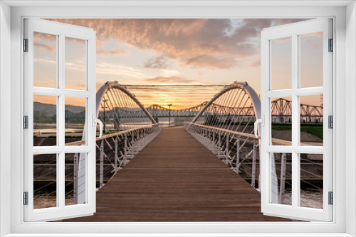 Fototapeta Naklejka Na Ścianę Okno 3D - Footbridge on Zglowiaczka in Wloclawek at sunrise