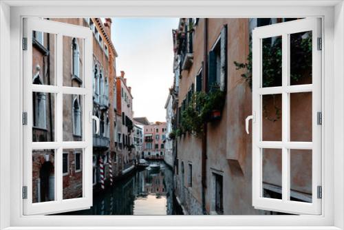 Fototapeta Naklejka Na Ścianę Okno 3D - Scenic narrow canal with ancient buildings with potted plants in Venice, Italy