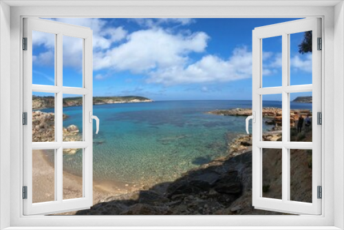 Fototapeta Naklejka Na Ścianę Okno 3D - Scenic view of a beach in Ibiza, with a sandy shoreline, blue sky, and turquoise waters