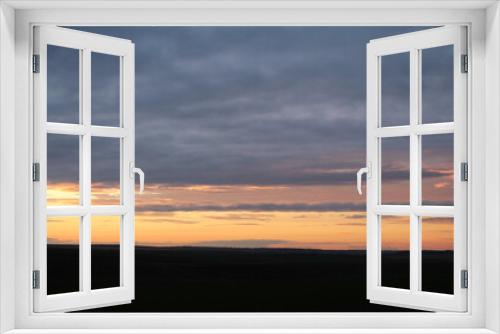 Fototapeta Naklejka Na Ścianę Okno 3D - A sunset over a field