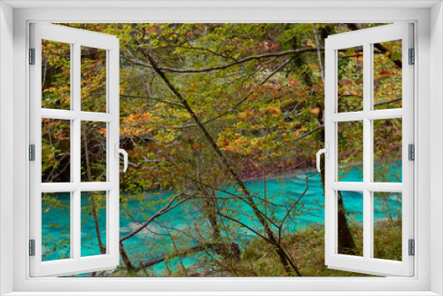 Fototapeta Naklejka Na Ścianę Okno 3D - The waterfalls and crystal clear, blue, turquoise and green waters of the Nacedero del Urederra, with its beech forest with its autumn colors in the Sierra de Urbasa-Andía. Navarre. Spain