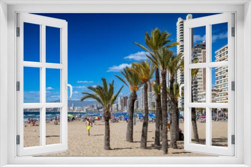 Fototapeta Naklejka Na Ścianę Okno 3D - Widok na palmy, plażę, hotele i morze śródziemne na brzegu Hiszpańskiego miasta Benidorm na Costa Blanca